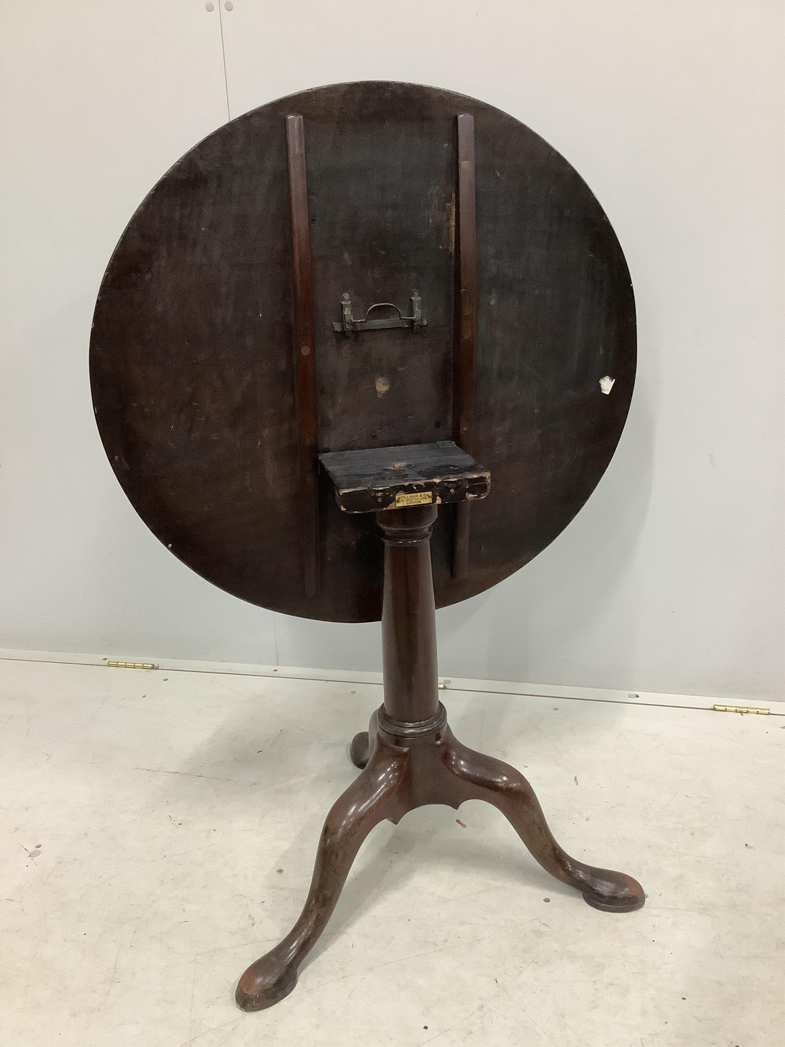 A George III circular mahogany tilt top tea table, diameter 81cm, height 71cm. Condition - fair to good